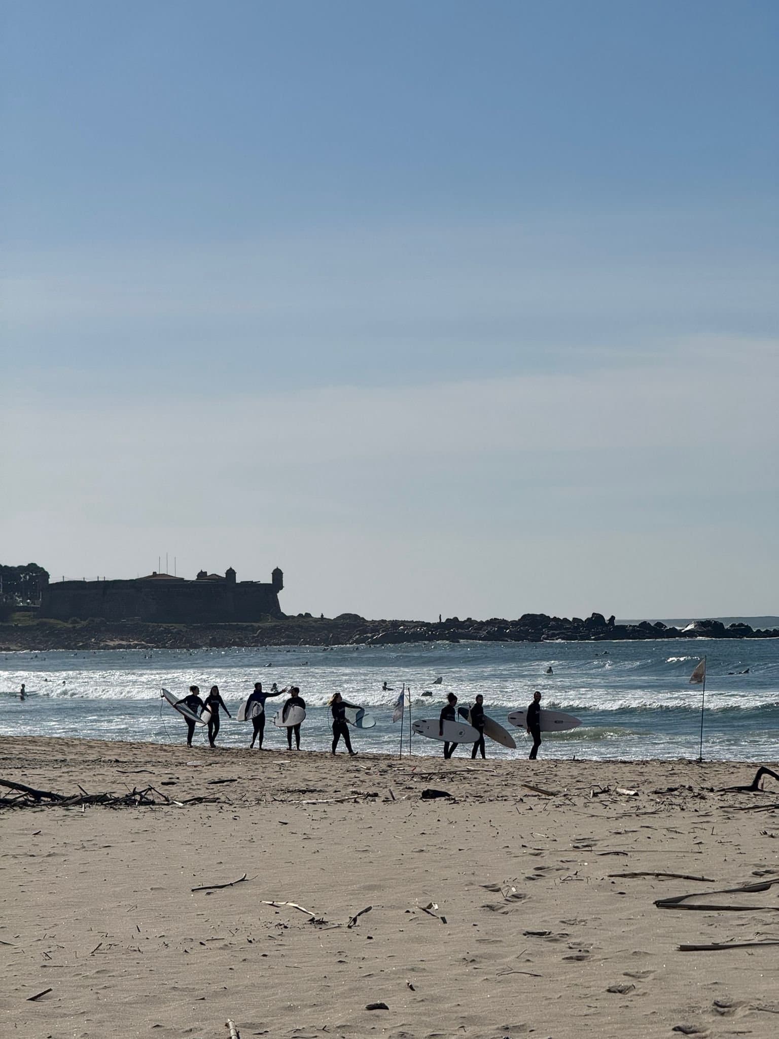 Surfers on Matosinhos beach by the Castelo do Queijo