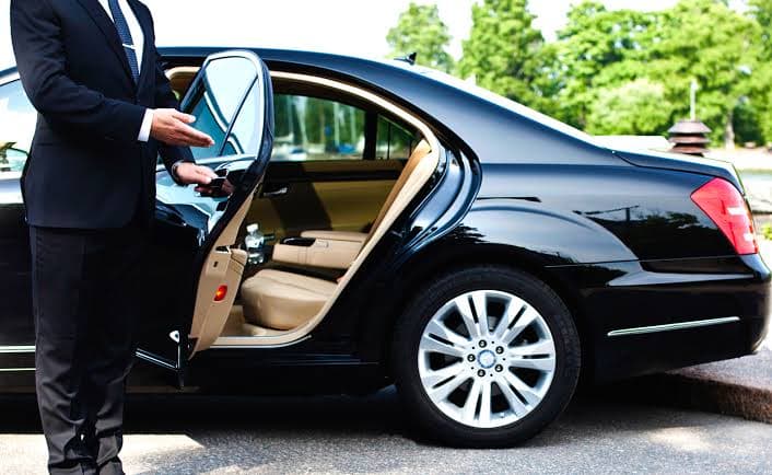 A private black car ready for airport pick-up