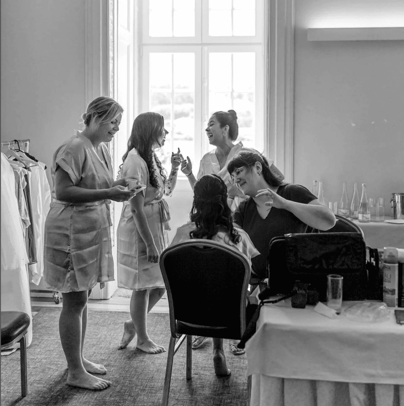 The bridal party having their make-up done on the morning of the wedding