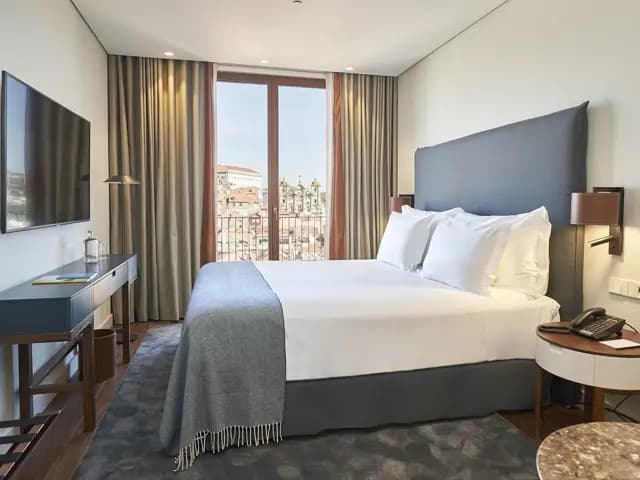 A guest room at PortoBay Flores with a view over the city